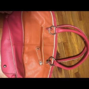 A women’s Pink and orange purse
